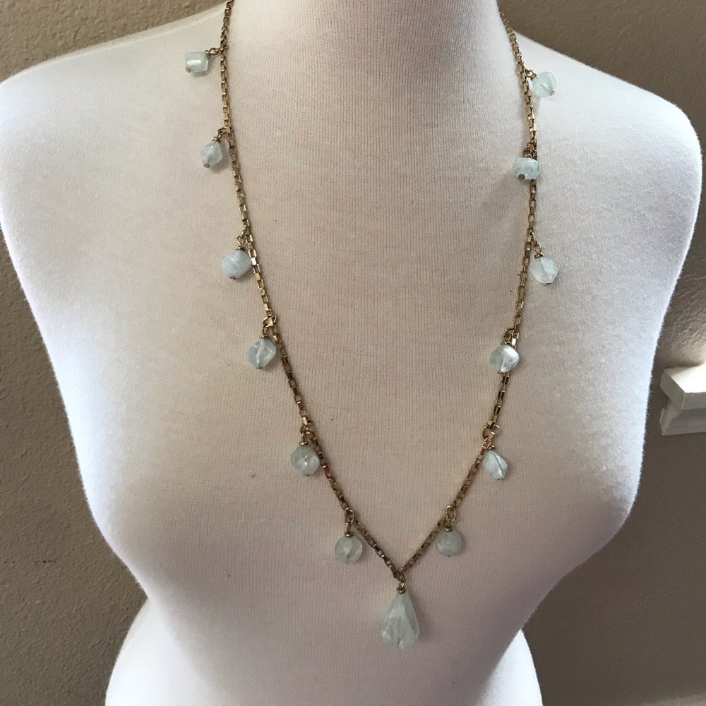 Gold tone necklace with aqua plastic beats 34”.